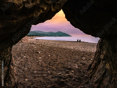 A colorful morning scene from a beach in south Turkey, taken through an opening between the rocks