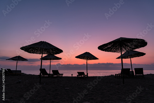 A beach in south Turkey with sunbeds and sunshades, taken right before sunrise
