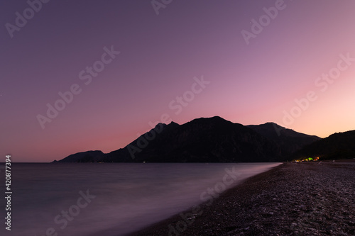 Long exposure image at dusk time from a pebble stone beach in south Turkey