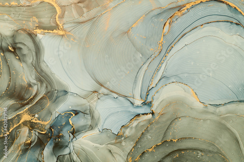 Fototapeta Naklejka Na Ścianę i Meble -  Currents of translucent hues, snaking metallic swirls, and foamy sprays of color shape the landscape of these free-flowing textures. Natural luxury abstract fluid art painting in alcohol ink technique