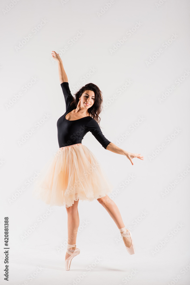 Flexible female, ballet dancer in black bodysuits