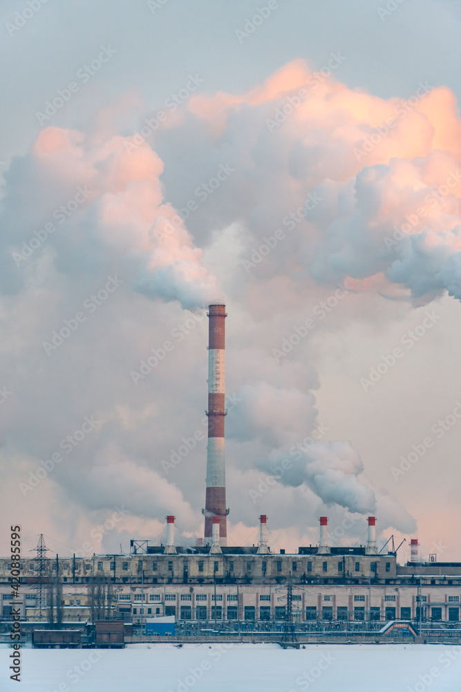 Factory pipes pollute atmosphere and Industrial plant air pollution, smokestack exhaust gases. Industry zone, thick smoke plumes. Climate change, ecology and global warming