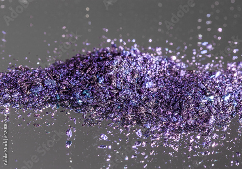 KMnO4 - Purple vivide crystals. (latin: Potassium permanganate). Colorful background. photo