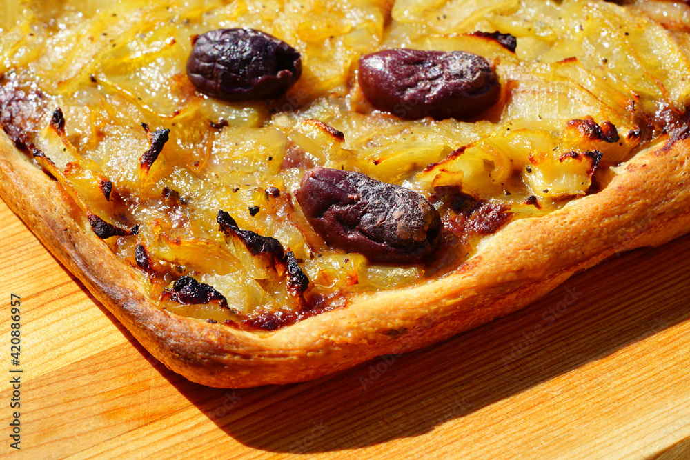 A French pissaladiere tart with onions and black olives