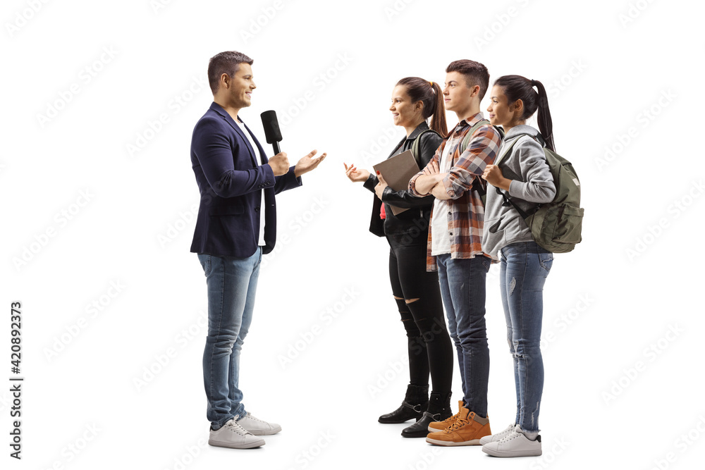 Male reporter interviewing a group of young students