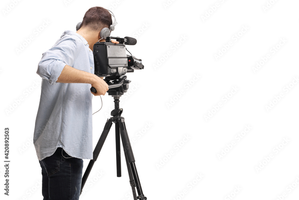 Rear shot of a cameraman recording with a professional camera on a stand