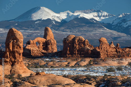 USA, Utah. Turret Arch and the snow-covered LaSal Mountains. Arches National Park.
