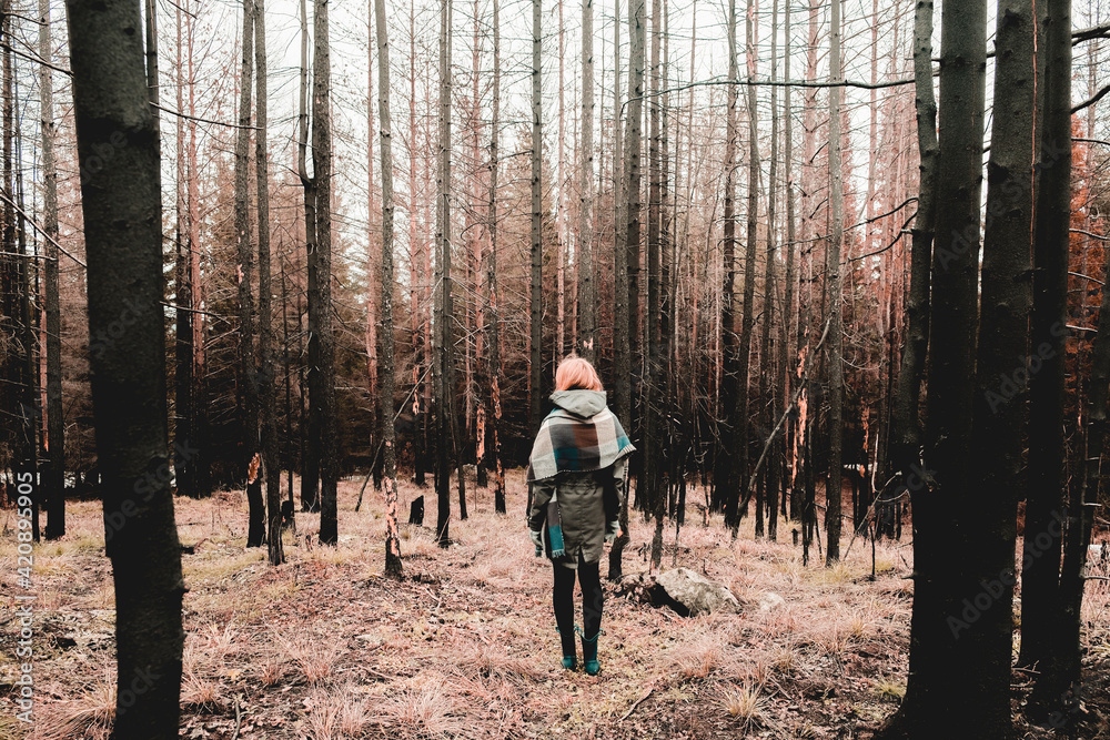 Woman standing in forest in winter, Ural, Sverdlovsk, Russia Woman standing in forest in winter, Ural, Sverdlovsk, Russia