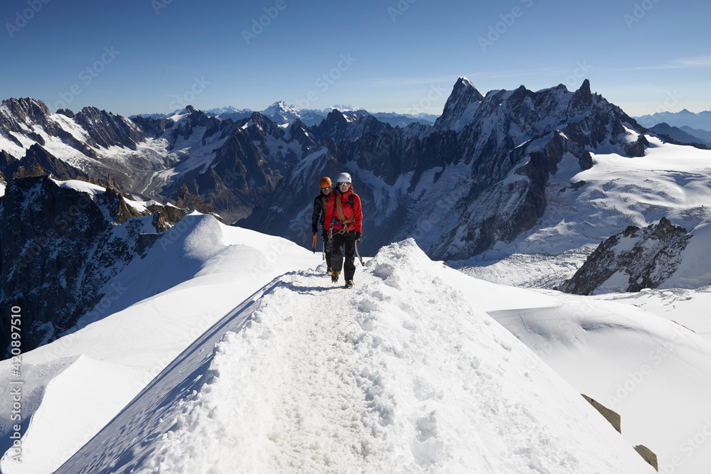 Mountain climbers on snowy trail, Chamonix, Rhone-Alps, France Mountain climbers on snowy trail, Chamonix, Rhone-Alps, France