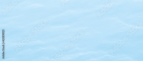 Blue Light coloured snow texture. fresh snow background