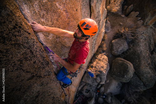 Climber trad climbing, Little Egypt, Bishop, California, USA photo