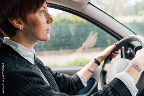 Woman concentrating on driving car photo