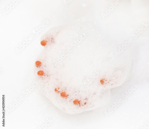 bath foam. baby hands in bubble bath, baby washing in bubble bath
