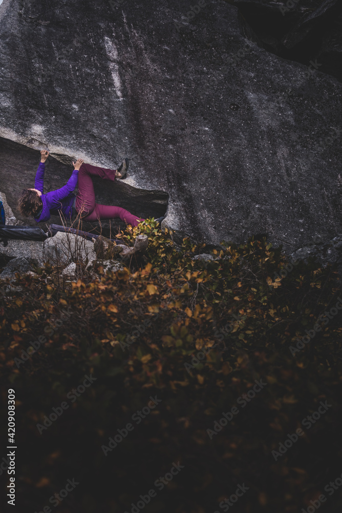 Climber bouldering in forest, Squamish, Canada Climber bouldering in forest, Squamish, Canada