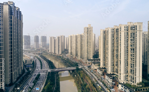 Skyscrapers along river, Leifeng, Hunan, China photo