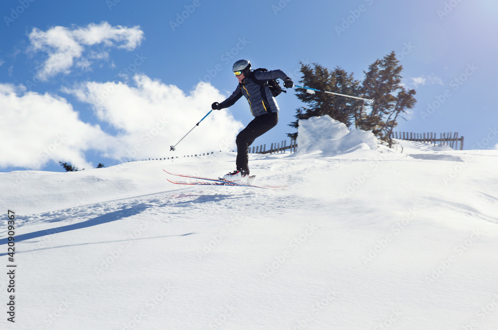 Mature man skiing down snow covered mountain, Styria, Tyrol, Austria Mature man skiing down snow covered mountain, Styria, Tyrol, Austria