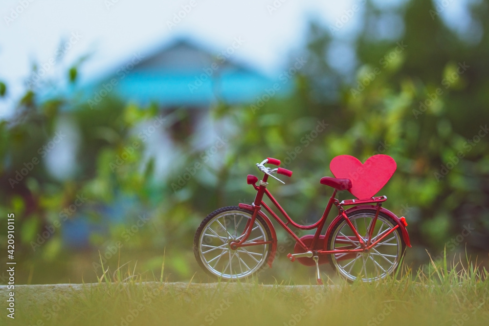 Red bicycle vintage in spring nature summer background copy spec, Red heart on bicycle