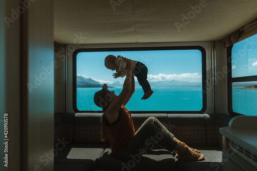 Wallpaper Mural Mother playing with baby in motorhome, Wanaka, Taranaki, New Zealand Torontodigital.ca