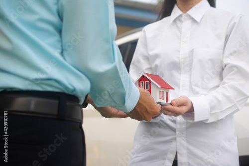 Salesman giving house to customer