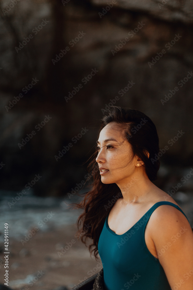 Woman enjoying breeze on beach, Big Sur, California, United States Woman enjoying breeze on beach, Big Sur, California, United States