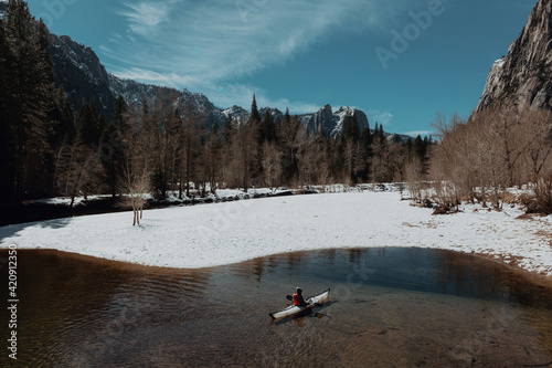 Man kayaking in lake, Yosemite Village, California, United States