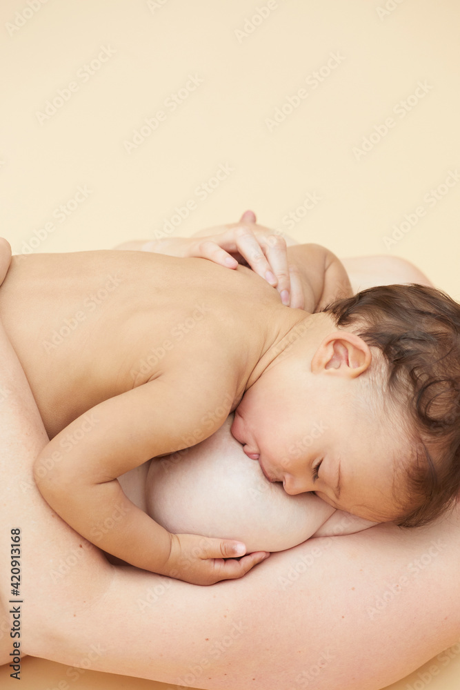 Naked baby sucking naked mother's breast Naked baby sucking naked mother's breast