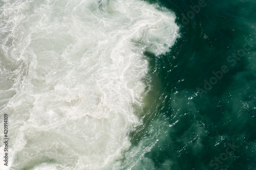 Sea foam being churned up