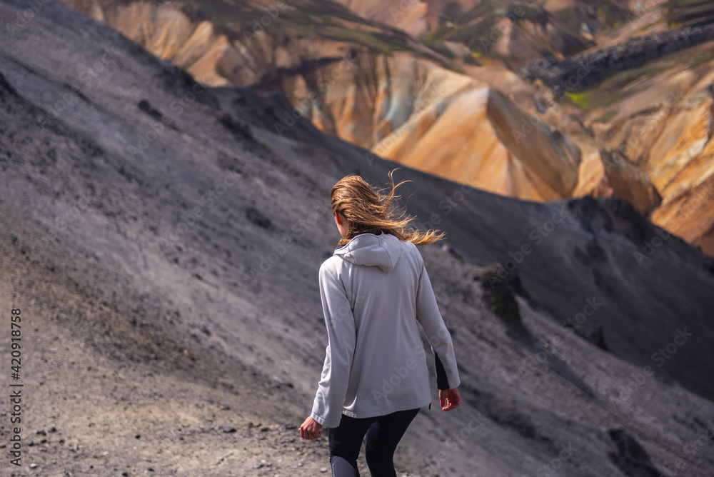 Hiker exploring mountains, Brennisteinsalda and Bláhnjúkur, Landmannalaugar, Highlands, Iceland