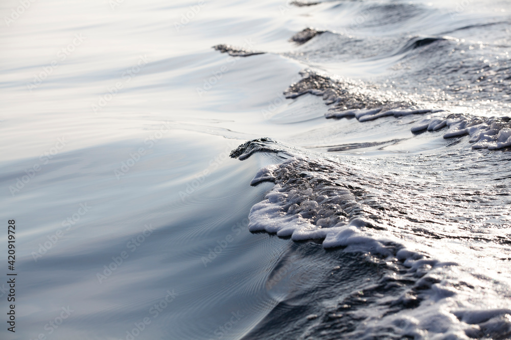 Sea foam and wave on sunny day Sea foam and wave on sunny day