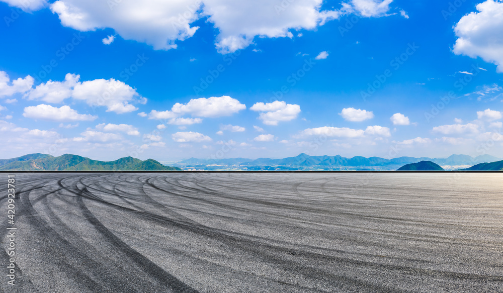 Race track road and green mountain in summer.