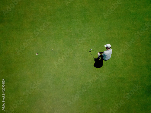 Man playing golf on golf course