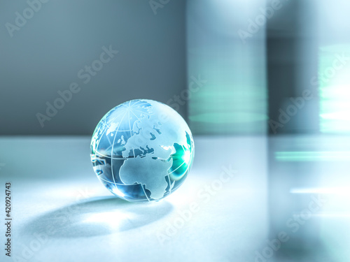 A glass globe of planet Earth illustrating global trade and networking.