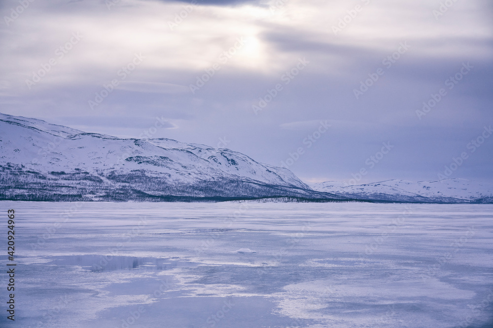 View across a frozen lake in Vasterbottens Lan, Sweden. View across a frozen lake in Vasterbottens Lan, Sweden.