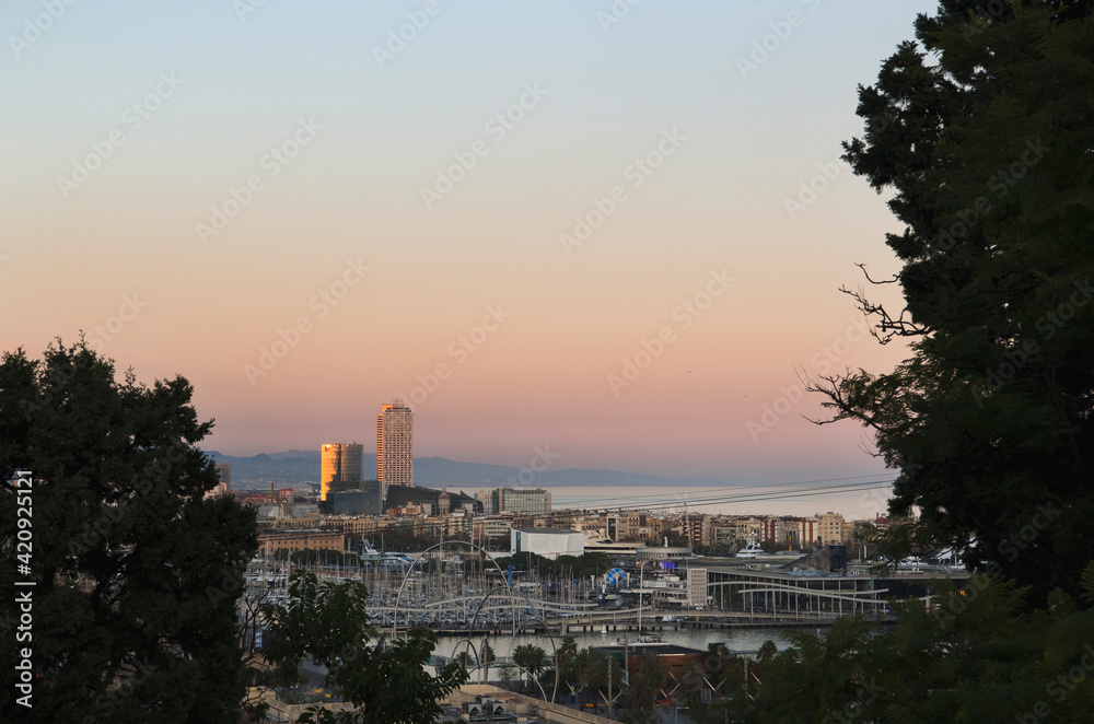 Elevated view from Montjüic to Barcelona harbour at sunset, Catalonia, Spain. Elevated view from Montjüic to Barcelona harbour at sunset, Catalonia, Spain.