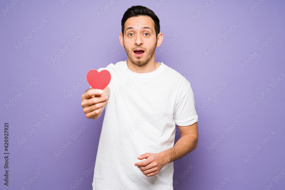 Cute young man giving his love to someone Cute young man giving his love to someone