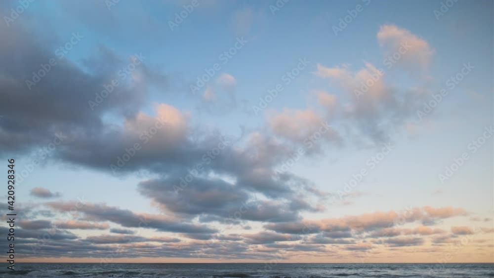 Blue Sky With Sunlit Clouds Over Horizon Of Sea Blue Sky With Sunlit Clouds Over Horizon Of Sea