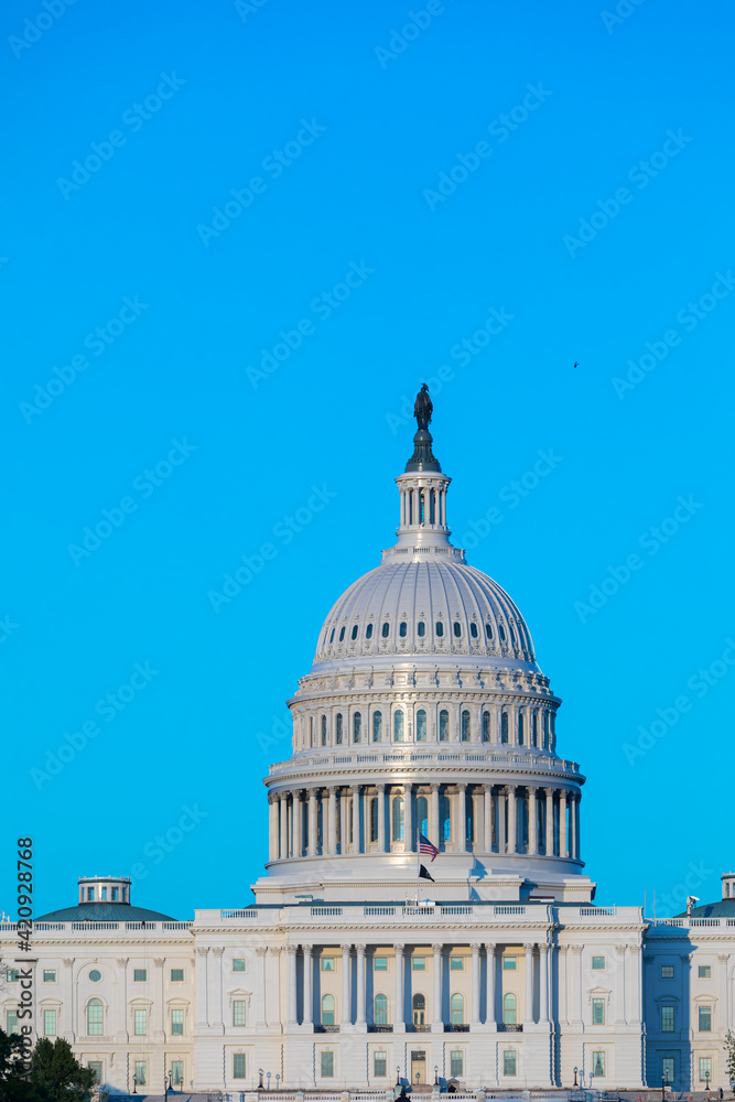 Washington, DC, USA - 27 April 2020: Close-up of the Cupola of the United States Capitol Building with blue Sky