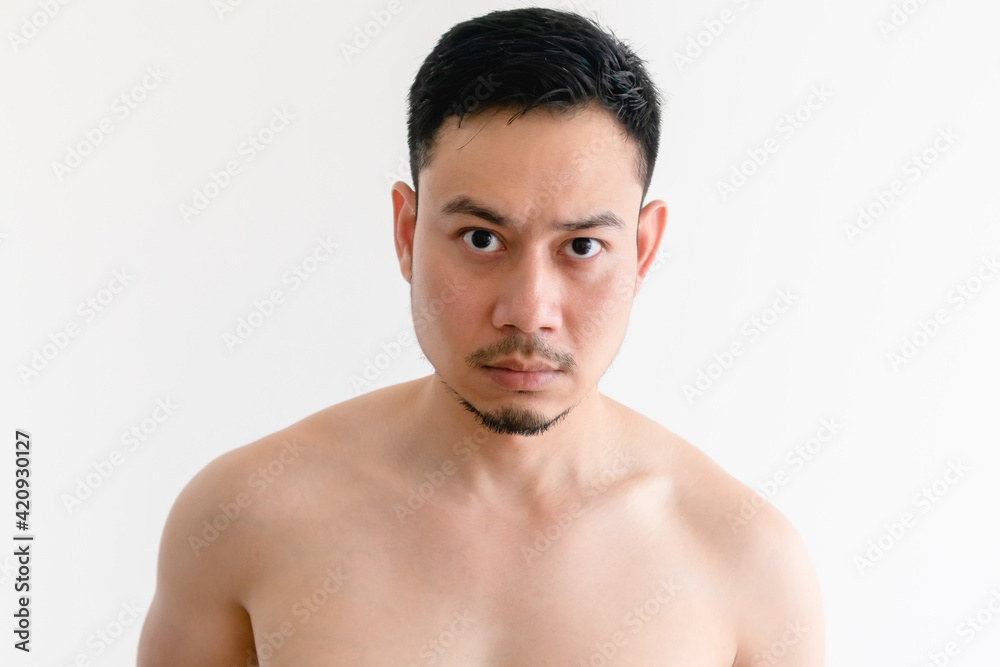 Portrait of topless Asian man with serious face on isolated background. Portrait of topless Asian man with serious face on isolated background.