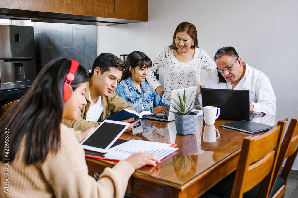latin Family at home as the pandemic coronavirus (COVID-19) forces many employees and students to work and study from home in Latin America latin Family at home as the pandemic coronavirus (COVID-19) forces many employees and students to work and study from home in Latin America