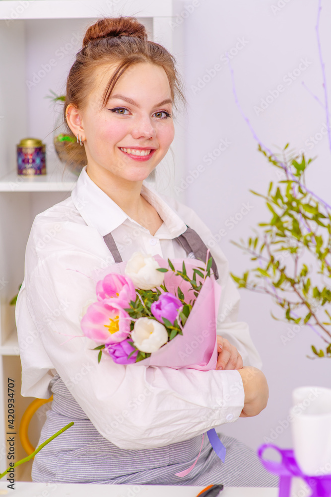 Smiling Woman Florist Small Business Flower Shop Owner. Happy woman gardener with flower Smiling Woman Florist Small Business Flower Shop Owner. Happy woman gardener with flower