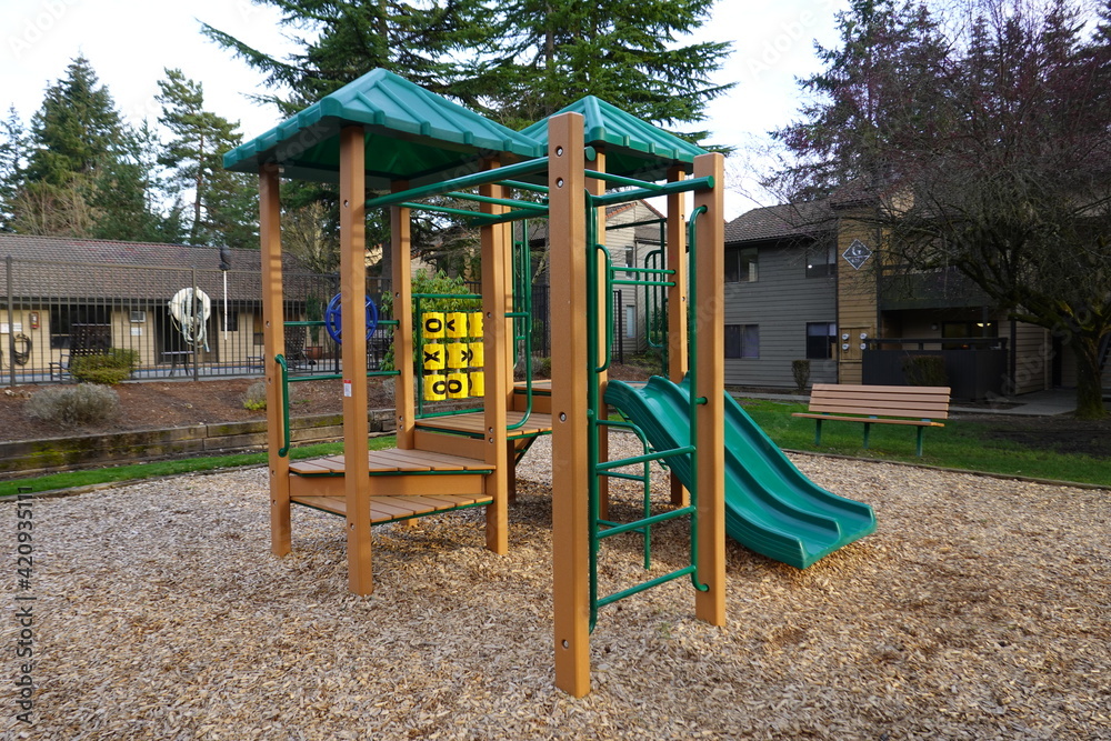 The urban playground at the public park surrounded by a lake. The urban playground at the public park surrounded by a lake.