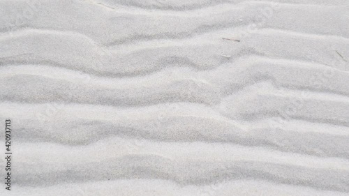 The zebra strips of the sand on the shore of the beach on a lowtide in Estonia photo