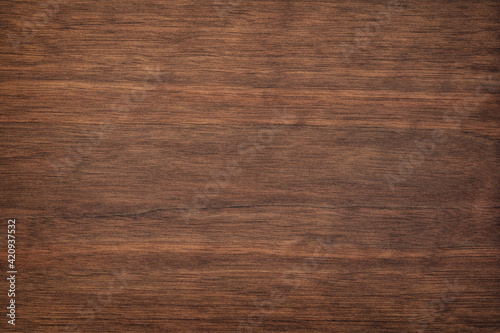 dark wood texture in walnut color. empty surface rustic table background. mahogany template for design photo