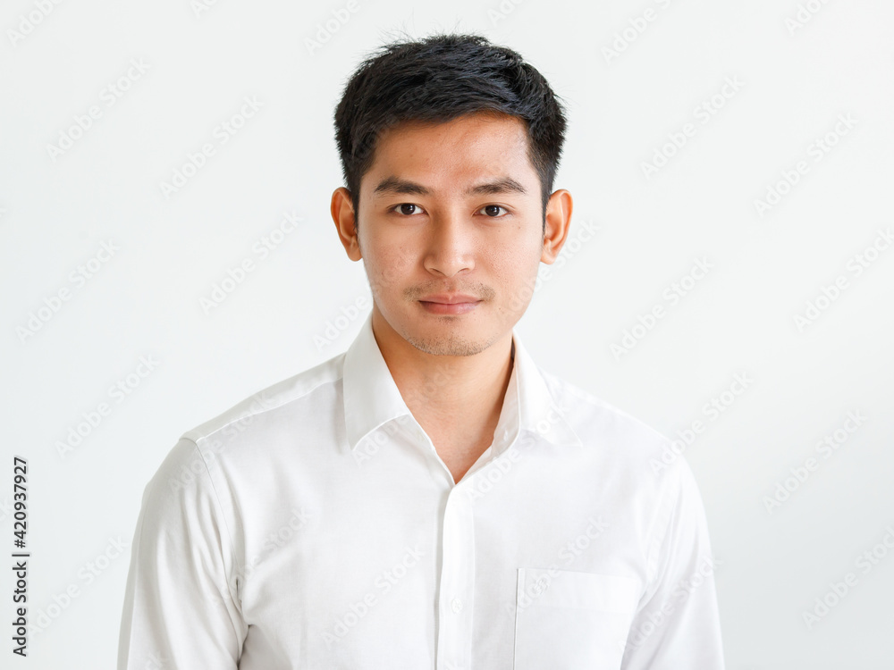 Confident male Asian entrepreneur looking at camera Confident male Asian entrepreneur looking at camera