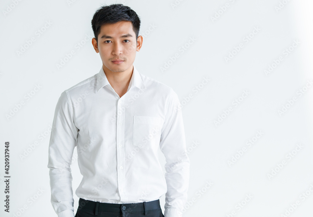 Confident male Asian entrepreneur looking at camera Confident male Asian entrepreneur looking at camera
