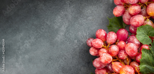 Εκτύπωση καμβά Fresh red grapes close up on dark background with copy space