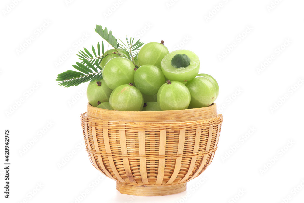 Indian Gooseberry or Phyllanthus emblica fruits and green leaves isolated on white background. Indian Gooseberry or Phyllanthus emblica fruits and green leaves isolated on white background.