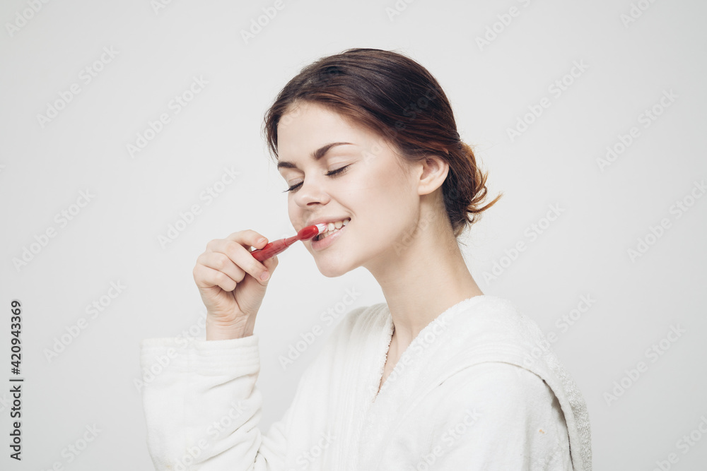 cheerful woman in robe toothbrush morning dental care cheerful woman in robe toothbrush morning dental care