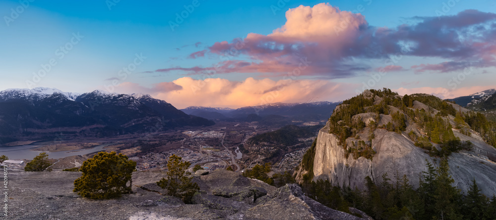 Panoramic View of Beautiful Canadian Landscape and Squamish City. Colorful Dramatic Sunset Sky Art Render. Taken from Chief Mountain, near Vancouver, British Columbia, Canada.