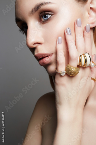 Beauty girl with jewelry rings. beautiful woman